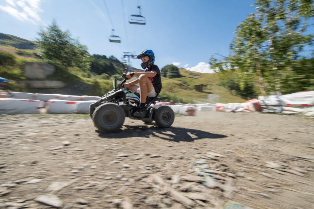 Profile photo showing a child on an electric quad on Number One trail in La Toussuire